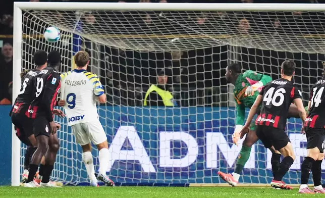 Parma's Adrian Bernabe scores a goal on Milan during the Serie A soccer match in Parma, Italy, Sunday, Nov. 8, 2025. (Massimo Paolone/LaPresse via AP)