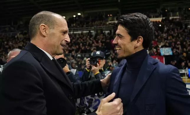 AC Milan's head coach Massimiliano Allegri, left, and Parma's head coach Carlos Cuesta greet each other prior to the Serie A soccer match between Parma and Milan in Parma, Italy, Sunday, Nov. 8, 2025. (Massimo Paolone/LaPresse via AP)