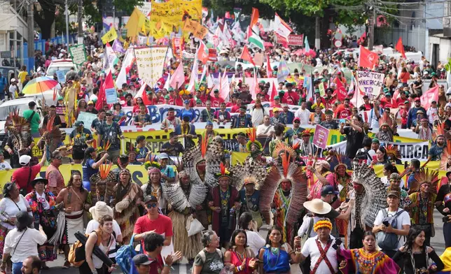 Activists participate in a climate protest during the COP30 U.N. Climate Summit, Saturday, Nov. 15, 2025, in Belem, Brazil. (AP Photo/Andre Penner)