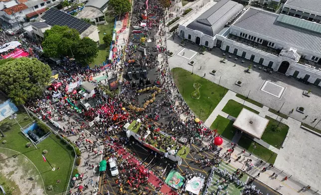 Activists participate in a climate protest during the COP30 U.N. Climate Summit, Saturday, Nov. 15, 2025, in Belem, Brazil. (AP Photo/Andre Penner)