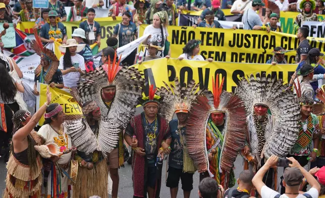 Activists participate in a climate protest during the COP30 U.N. Climate Summit, Saturday, Nov. 15, 2025, in Belem, Brazil. (AP Photo/Andre Penner)