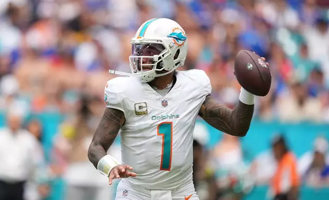 Miami Dolphins quarterback Tua Tagovailoa throws during the first half of an NFL football game against the Buffalo Bills, Sunday, Nov. 9, 2025, in Miami Gardens, Fla. (AP Photo/Rebecca Blackwell)