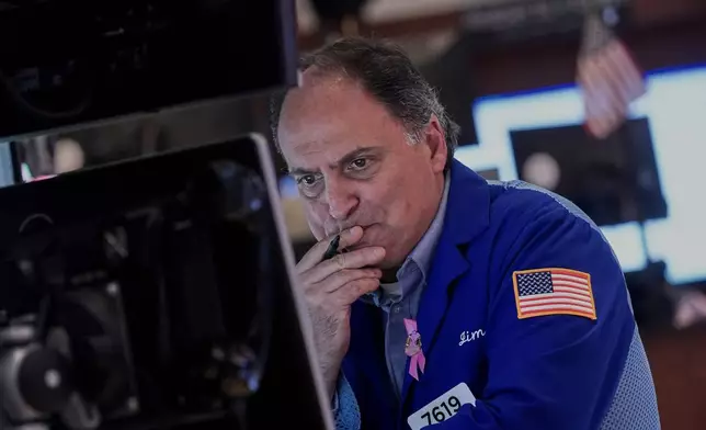 Trader James Conti works on the floor of the New York Stock Exchange, Thursday, Nov. 6, 2025. (AP Photo/Richard Drew)