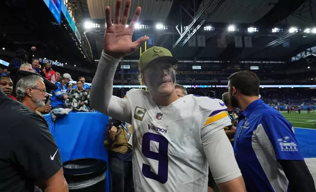 Minnesota Vikings quarterback J.J. McCarthy (9) waves while leaving the field after an NFL football game against the Detroit Lions Sunday, Nov. 2, 2025, in Detroit. (AP Photo/Ryan Sun)