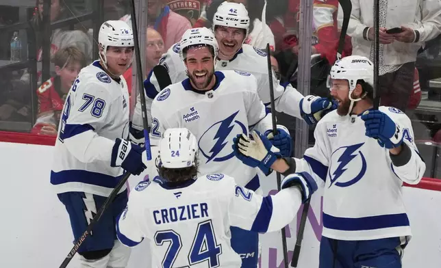 Tampa Bay Lightning center Jack Finley (62) celebrates his goal during the third period of an NHL hockey game against the Florida Panthers, Saturday, Nov. 15, 2025, in Sunrise, Fla. (AP Photo/Marta Lavandier)