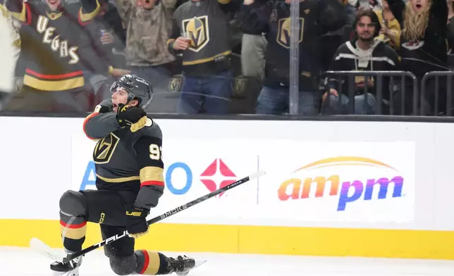 Vegas Golden Knights right wing Mitch Marner (93) celebrates after scoring a goal against the San Jose Sharks during the second period of an NHL hockey game Saturday, Nov. 29, 2025, in Las Vegas. (AP Photo/Ian Maule)