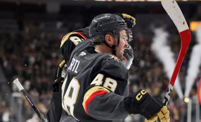 Vegas Golden Knights center Tomas Hertl (48) celebrates after his second goal of the game against the San Jose Sharks during the second period of an NHL hockey game Saturday, Nov. 29, 2025, in Las Vegas. (AP Photo/Ian Maule)
