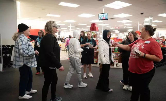 Shoppers enter a Kohl's department store for Black Friday, Friday, Nov. 28, 2025, in Woodstock, Ga. (AP Photo/Megan Varner)