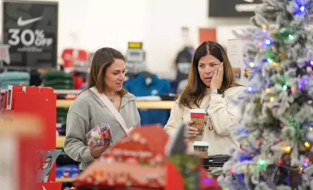 Shoppers browse through Kohl's department store for Black Friday deals, Friday, Nov. 28, 2025, in Woodstock, Ga. (AP Photo/Megan Varner)