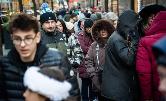Black Friday shoppers queue to enter FAO Schwarz in New York on Friday, Nov. 28, 2025. (AP Photo/Angelina Katsanis)