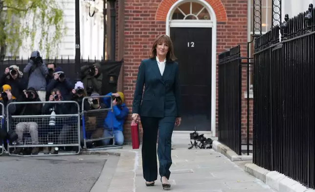 Britain's Chancellor of the Exchequer Rachel Reeves departs 11 Downing Street with her ministerial red box before heading to the House of Commons to deliver her Budget speech in London, Wednesday, Nov. 26, 2025.(AP Photo/Frank Augstein, Pool)