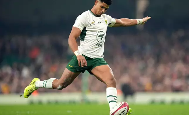 South Africa's Sacha Mngomezulu kicks a conversion during the rugby union international match between Wales and South Africa in Cardiff, Wales, Saturday Nov. 29, 2025. (Andrew Matthews/PA via AP)