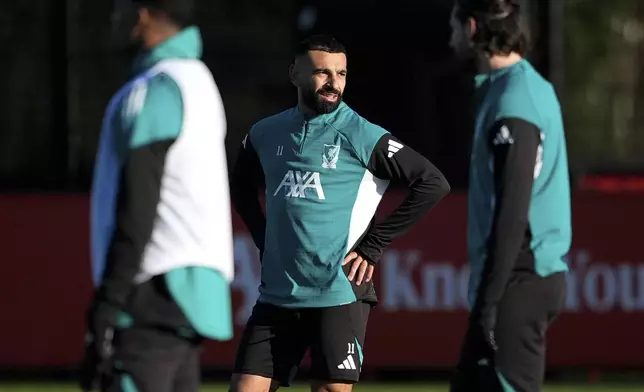 Liverpool's Mohamed Salah, center, attends a team training session at the AXA Training Centre, Liverpool, England, Tuesday, Nov. 25, 2025, ahead of Wednesday's Champions League match against PSV Eindhoven. (Peter Byrne/PA via AP)