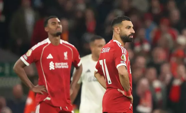 Liverpool's Mohamed Salah, right, and Ryan Gravenberch react after Nottingham Forest's Morgan Gibbs-White scored his side's third goal during the English Premier League soccer match between Liverpool and Nottingham Forest in Liverpool, England, Saturday, Nov. 22, 2025. (AP Photo/Ian Hodgson)