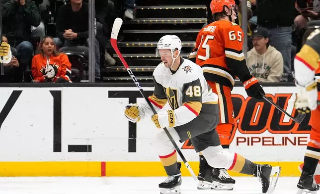 Vegas Golden Knights center Tomas Hertl, left, celebrates his goal as Anaheim Ducks defenseman Jacob Trouba skates away during the first period of an NHL hockey game Saturday, Nov. 22, 2025, in Anaheim, Calif. (AP Photo/Mark J. Terrill)