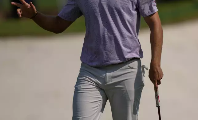 Nicolai Hojgaard of Denmark reacts after a birdie on the 5th hole during the second round of World Tour Golf Championship at Jumeirah Golf Estates, in Dubai, United Arab Emirates, Friday, Nov. 14, 2025. (AP Photo/Altaf Qadri)