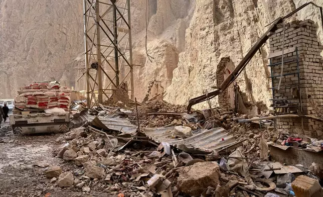Damage is seen along a road near the site of a powerful 6.3-magnitude earthquake in a rural area of the Khulm District in Samangan Province, northern Afghanistan, Monday, Nov. 3, 2025. (AP Photo/Sirat Noori)