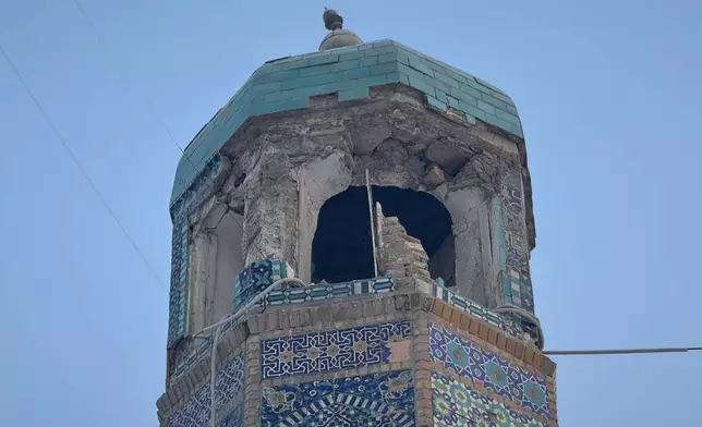 Damage is seen in the historic Blue Mosque after a powerful 6.3-magnitude earthquake in Mazar-e-Sharif, northern Afghanistan, Monday, Nov. 3, 2025. (AP Photo/Sirat Noori)