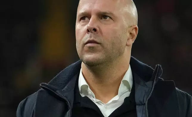Liverpool's manager Arne Slot waits for the start of the Champions League opening phase soccer match between Liverpool and PSV in Liverpool, England, Wednesday, Nov. 26, 2025. (AP Photo/Jon Super)