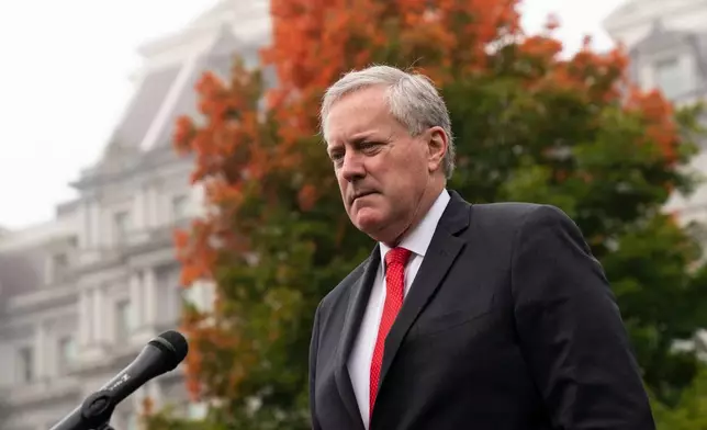 FILE - White House chief of staff Mark Meadows speaks with reporters at the White House, Oct. 21, 2020, in Washington. (AP Photo/Alex Brandon, File)