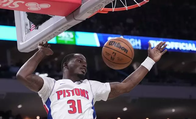 Detroit Pistons' Javonte Green dunks during the first half of an NBA basketball game Saturday, Nov. 22, 2025, in Milwaukee. (AP Photo/Morry Gash)