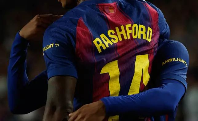 Barcelona's Marcus Rashford celebrates after scoring his side's third goal during a Spanish La Liga soccer match between FC Barcelona and Elche CF in Barcelona, Spain, Sunday, Nov. 2, 2025. (AP Photo/Joan Monfort)