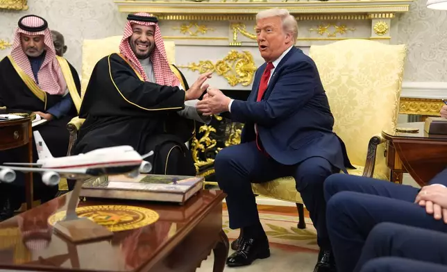 President Donald Trump meets Saudi Arabia's Crown Prince Mohammed bin Salman in the Oval Office of the White House, Tuesday, Nov. 18, 2025, in Washington. (AP Photo/Evan Vucci)