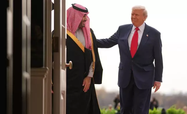 President Donald Trump welcomes Saudi Arabia's Crown Prince Mohammed bin Salman to the White House, Tuesday, Nov. 18, 2025, in Washington. (AP Photo/Evan Vucci)