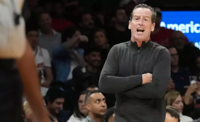 Cleveland Cavaliers head coach Kenny Atkinson reacts after he is charged with a technical foul during the first half of an NBA basketball game against the Miami Heat Monday, Nov. 10, 2025, in Miami. (AP Photo/Marta Lavandier)