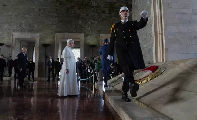 Pope Leo XIV poses a wreath at the Ataturk Mausoleum in Ankara, Turkey, Thursday, Nov. 27, 2025. (AP Photo/Domenico Stinellis)