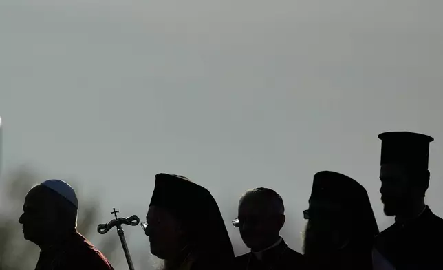 Pope Leo XIV, left, and Ecumenical Patriarch Bartholomew I, the spiritual leader of the world's Eastern Orthodox Christians, second left, leave after an Ecumenical prayer service at archaeological excavations of the ancient Byzantine-era Christian Saint Neophytos Basilica, in Iznik, Turkey, Friday, Nov. 28, 2025, marking the 1,700 years anniversary of the Council of Nicaea. (AP Photo/Khalil Hamra)
