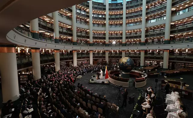 Pope Leo XIV delivers his speech as he meets with authorities, members of the civil society and diplomats in the Presidential Palace's national library, in Ankara, Turkey, Thursday, Nov. 27, 2025. (AP Photo/Domenico Stinellis)