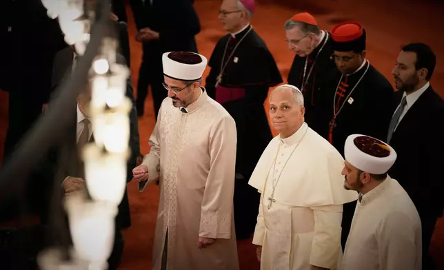 Pope Leo XIV visits the Ottoman-era Sultan Ahmed or Blue Mosque, in Istanbul, Turkey, Saturday, Nov. 29, 2025. (AP Photo/Emrah Gurel)