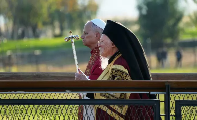 Pope Leo XIV and the Ecumenical Patriarch Bartholomew I, right, lead an Ecumenical prayer service near the archaeological excavations of the ancient Basilica of Saint Neophytos, in Iznik, Turkey, Friday, Nov. 28, 2025. (AP Photo/Domenico Stinellis)