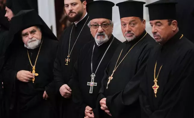 Orthodox clerics wait for Pope Leo XIV to arrive for a doxology service at the Patriarchal Church of Saint George, in Istanbul, Turkey, Saturday, Nov. 29, 2025. (AP Photo/Francisco Seco)