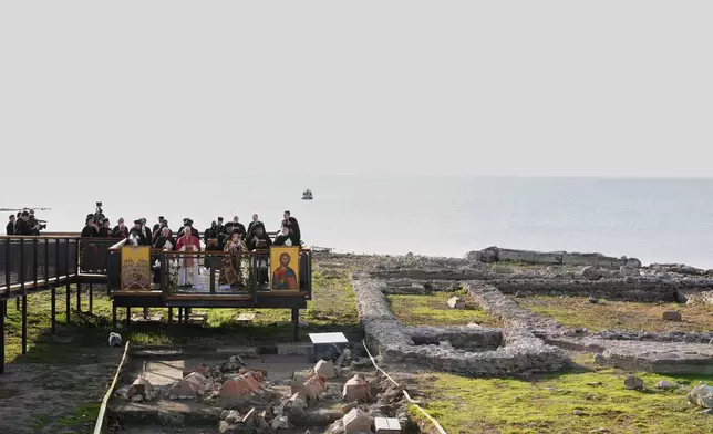 Pope Leo XIV and the Ecumenical Patriarch Bartholomew I lead an Ecumenical prayer service near the archaeological excavations of the ancient Basilica of Saint Neophytos, in Iznik, Turkey, Friday, Nov. 28, 2025. (AP Photo/Domenico Stinellis)