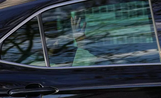 Pope Leo XIV waves to the people as he leaves the Cathedral of the Holy Spirit, in Istanbul, Turkey, Friday, Nov. 28, 2025, during his first foreign trip. (AP Photo/Emrah Gurel)