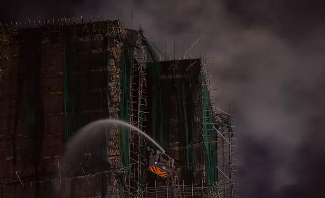 Firefighting efforts continue for a second day after a fire at Wang Fuk Court, a residential estate in the Tai Po district of Hong Kong's New Territories, Thursday, Nov. 27, 2025. (AP Photo/Ng Han Guan)