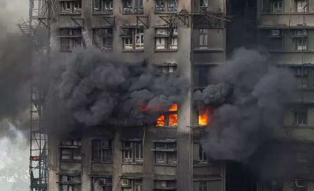 A fire can be seen at Wang Fuk Court, a residential estate in the Tai Po district of Hong Kong's New Territories, Thursday, Nov. 27, 2025. (AP Photo/Chan Long Hei)