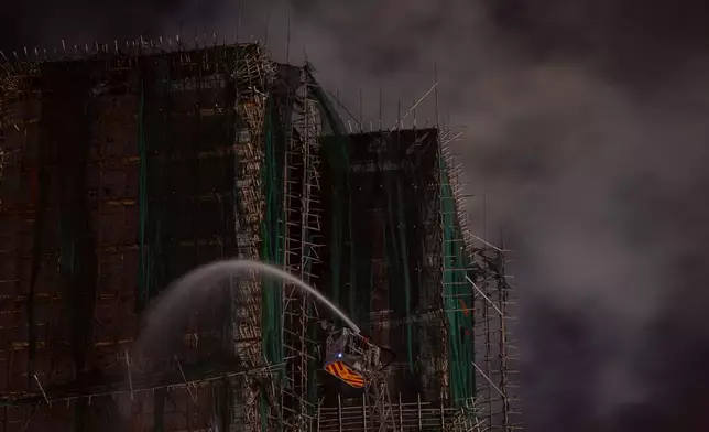 Firefighting efforts continue a second day after a fire at Wang Fuk Court, a residential estate in the Tai Po district of Hong Kong's New Territories, Thursday, Nov. 27 2025. (AP Photo/Ng Han Guan)
