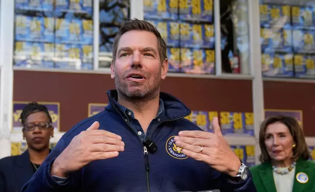 FILE - Rep. Eric Swalwell, D-Calif., speaks to reporters after a campaign event on Proposition 50 in San Francisco, on Nov. 3, 2025. (AP Photo/Jeff Chiu, File)