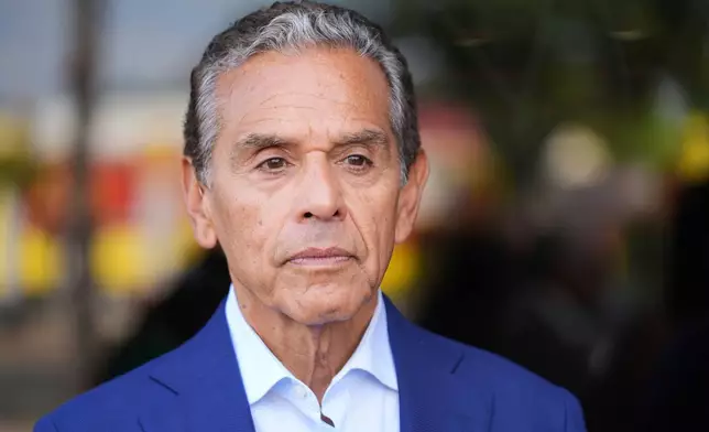 FILE - Antonio Villaraigosa receives an endorsement for governor of California by Mayor Karen Bass on Sept. 9, 2025, in Los Angeles. (AP Photo/Damian Dovarganes, File)