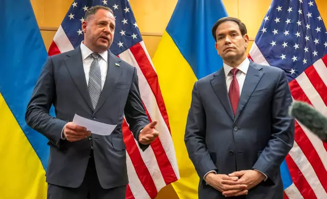 Head of the Office of the President of Ukraine Andriy Yermak, second right, and U.S. Secretary of State Marco Rubio talk to the press as their consultations continue at the U.S. Mission to International Organizations in Geneva, Switzerland, Sunday, Nov. 23, 2025. (Martial Trezzini/Keystone via AP)
