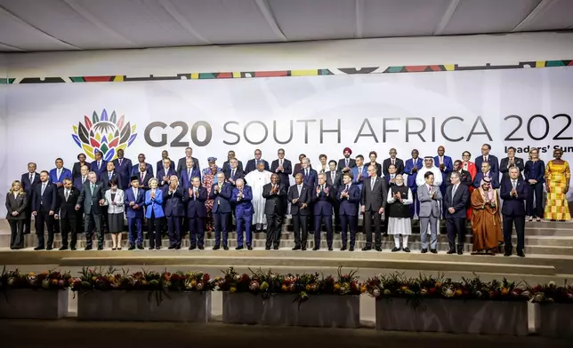 Leaders and delegates pose for a group photo, on the opening day of the G20 Leaders' Summit, in Johannesburg, South Africa, Saturday, Nov. 22, 2025. (Gianluigi Guercia/Pool Photo via AP)