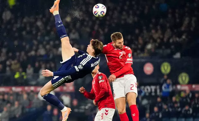 Scotland's Scott McTominay scores the opening goal during the 2026 World Cup European Qualifying soccer match between Scotland and Denmark at Hampden Park, Glasgow, Scotland, Tuesday, Nov. 18, 2025. (Andrew Milligan/PA via AP)