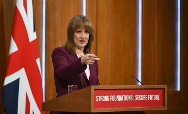 Britain's Chancellor of the Exchequer Rachel Reeves takes journalists' questions after delivering a speech in the media briefing room of 9 Downing Street, London, Tuesday Nov. 4, 2025. (Justin Tallis/Pool Photo via AP)