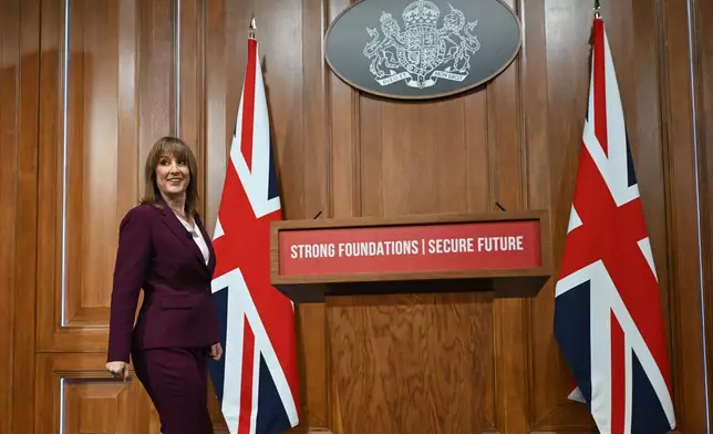 Britain's Chancellor of the Exchequer Rachel Reeves arrives to deliver a speech in the media briefing room of 9 Downing Street, London, Tuesday Nov. 4, 2025. (Justin Tallis/Pool Photo via AP)