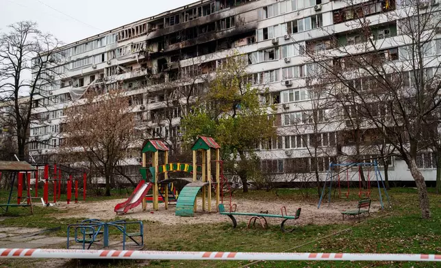 A residential building is seen heavily damaged after a Russian strike on Kyiv, Ukraine, on Tuesday, Nov. 25, 2025. (AP Photo/Evgeniy Maloletka)