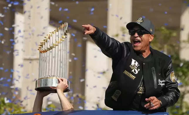 Los Angels Dodgers manager Dave Roberts celebrates during a parade to celebrate the baseball team's World Series win on Monday, Nov. 3, 2025, in Los Angeles. (AP Photo/Jae C. Hong)