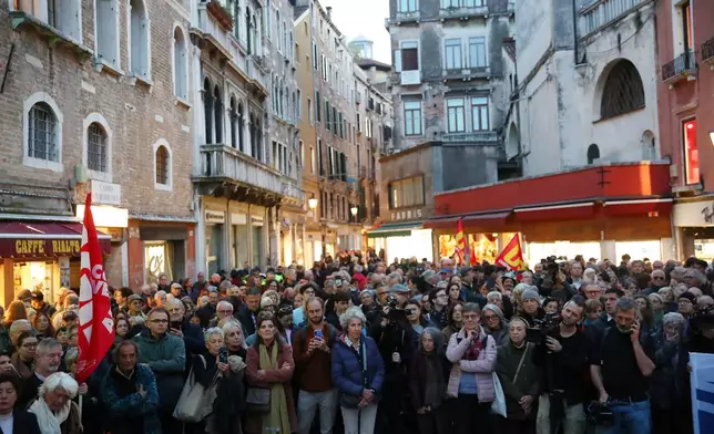 Workers and orchestra members of Venice’s La Fenice opera house, joined by other performing arts professionals, march through the city demanding the resignation of superintendent Nicola Colabianchi and artistic director Beatrice Venezi, in Venice, Italy, Monday, Nov. 10, 2025. (Paola Garbuio/LaPresse via AP)